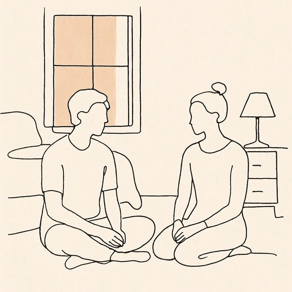 Line art of two figures sitting on a bedroom floor in soft window light, hands resting in laps
