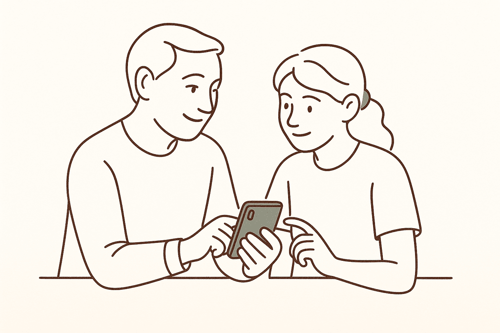 A parent and teen looking at a phone and talking