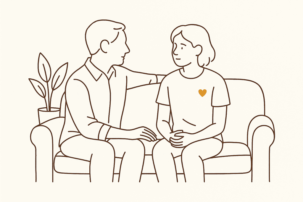 A supportive parent and teen talking on a couch
