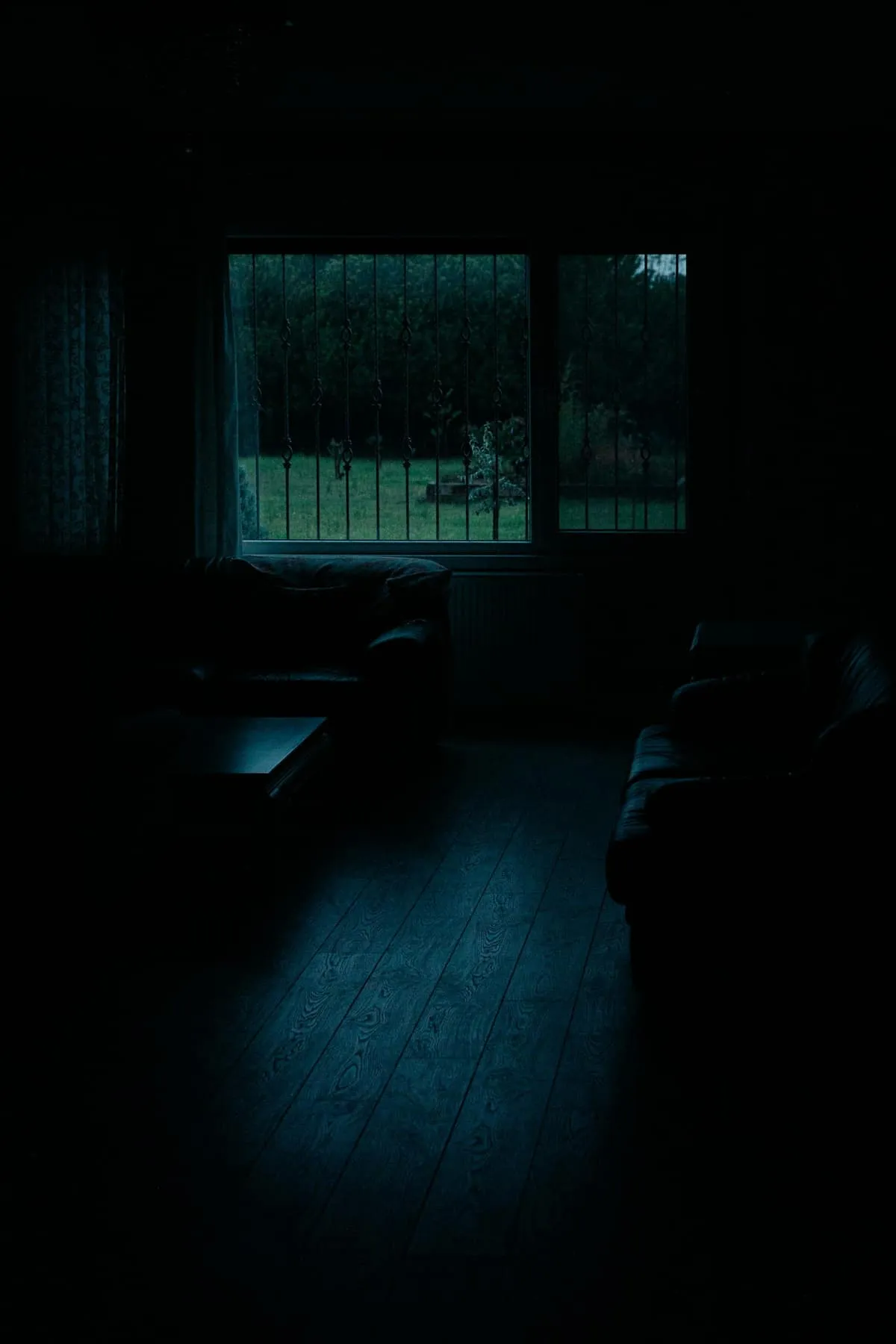 A phone face-down in dim light