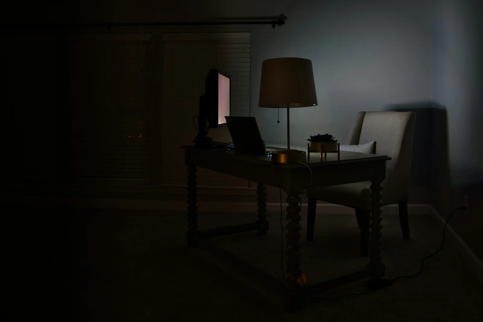 A phone displaying an unread message in a darkened room